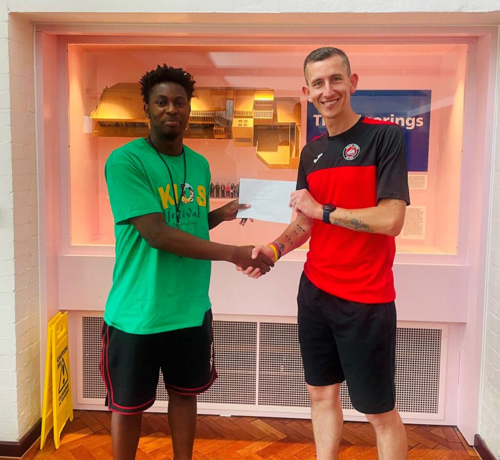 Michael Avery presents voucher to Moorings Sociable Club