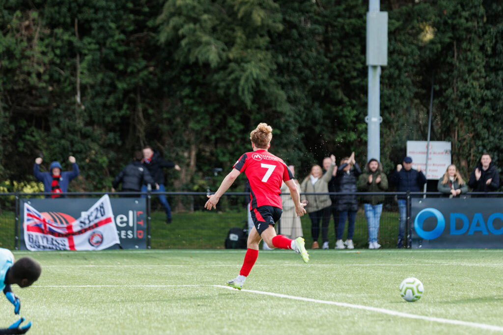James Dyer wheels away in celebration after putting away his spot kick.