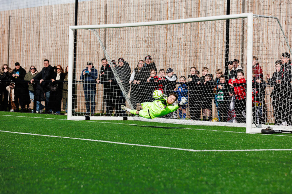 Mackenzie Foley makes the vital penalty save in the SCEFL Challenge Cup Final