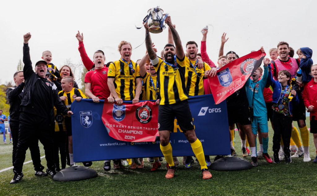 Dockers' Captain Ryan Mahal holds the Kent Senior Trophy Aloft as the Team Celebrates