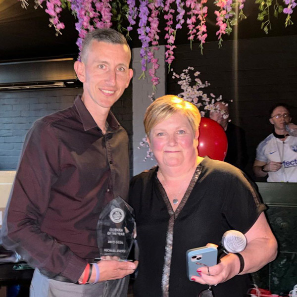 Michael Avery is presented with his award for Clubman of the Year 2024 by Chairwoman, Kay Deveney