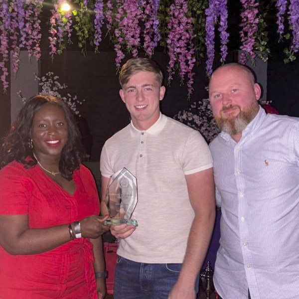 Young Player of the Year went to Tom Ash. He he is being presented with the award by MP for Erith & Thamesmead, Abena Oppong-Asare and First Team Manager, Adam Woodward.