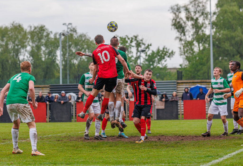 Harry Taylor heads home