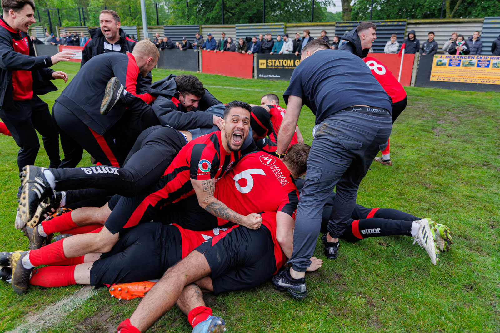 End of match pile-on as Dockers celebrate promotion