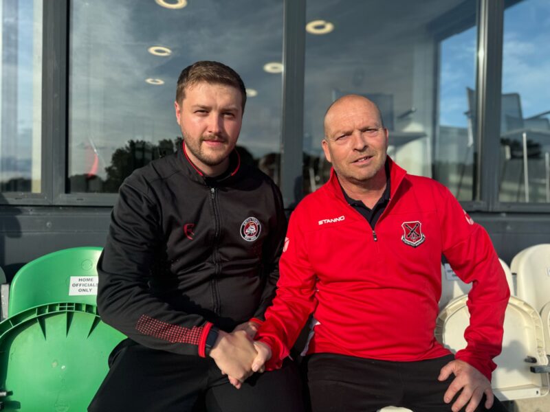 Dean Flower and Lee Hill shake hands on the new partnership.