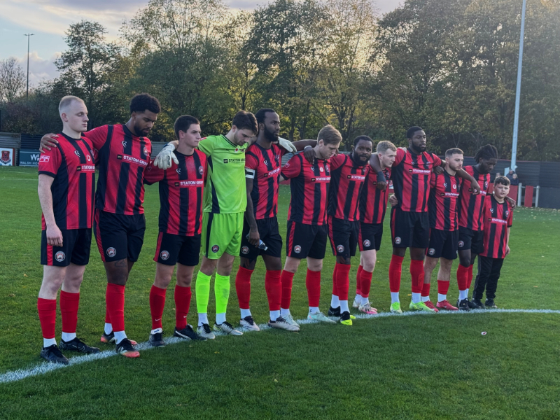 The Dockers first team observe the one minute silence for Rememberance Day.